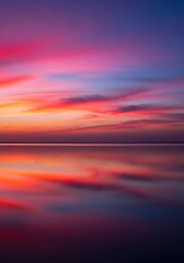 A serene natural landscape at twilight. Calm, glassy water reflects the fading, dramatic colors of the evening sky, purple, landscape, reservoir