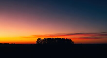 Fototapeta premium The tranquil twilight embraces the landscape, painting a golden hour silhouette against the picturesque evening sky as nightfall approaches, outdoor, dusk, nature