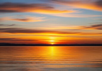 Obraz premium Tranquil golden hour landscape at the horizon during a stunning sunset, evoking peacefulness and natural serenity, background, warm, clouds