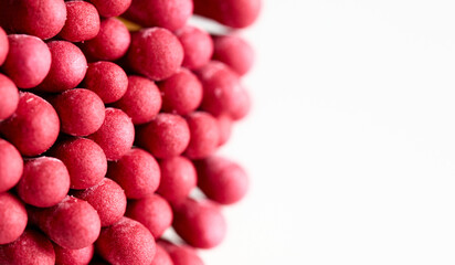 Vibrant red matches stacked closely together