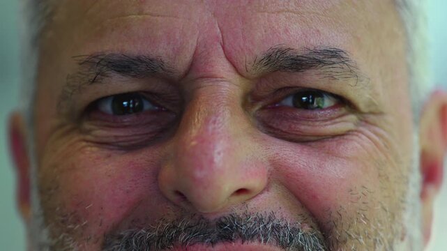 Macro close up of middle aged man smiling softly, detailed portrait showing warmth, humanity, and the emotional depth of lived experience