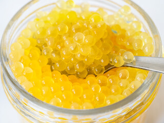 yellow caviar of river rainbow trout fish close up
