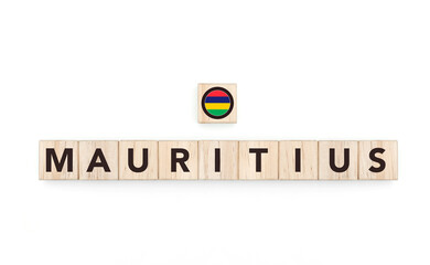 Wooden blocks bearing the name and flag of Mauritius. Mauritian and Indian Ocean Culture, national identity, travel, and geography in a copy space design.