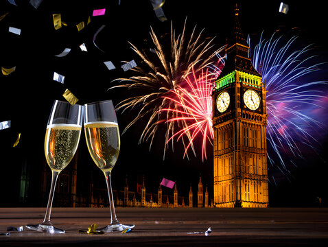 Champagne glasses and fireworks celebrate new year s eve in london