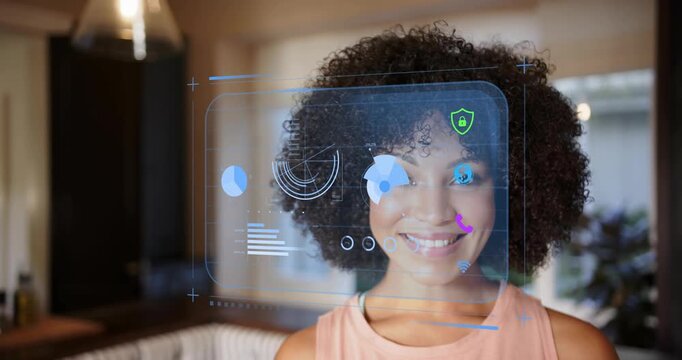Woman in home, AR panel appearing, scanning face and aligning markers smiling and laughing for tech