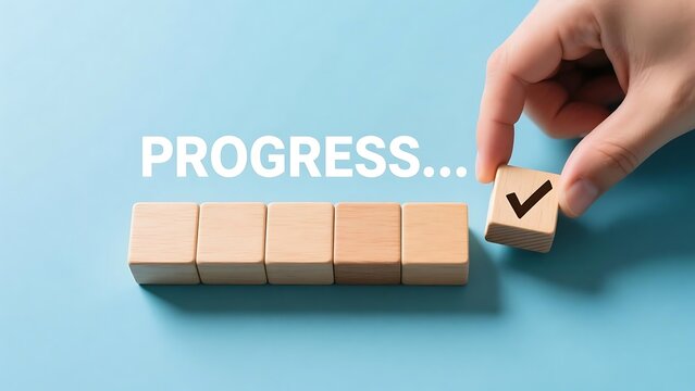 Progress concept with wooden blocks and check mark symbol for business success and achievement goals