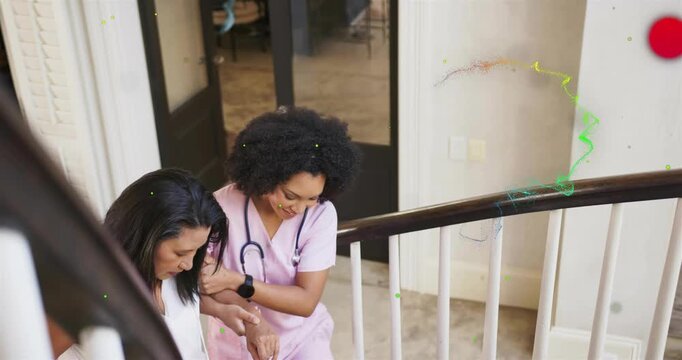 Nurse placing arm under patient and guiding down staircase, checking smartwatch for medical safety