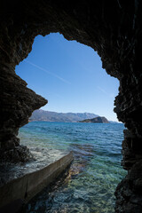 View from the cave to the sea and mountains.