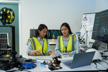 Technicians work with a 3D printer to print a clear white plastic model using cutting-edge technology, focusing on specific points, in a lab.