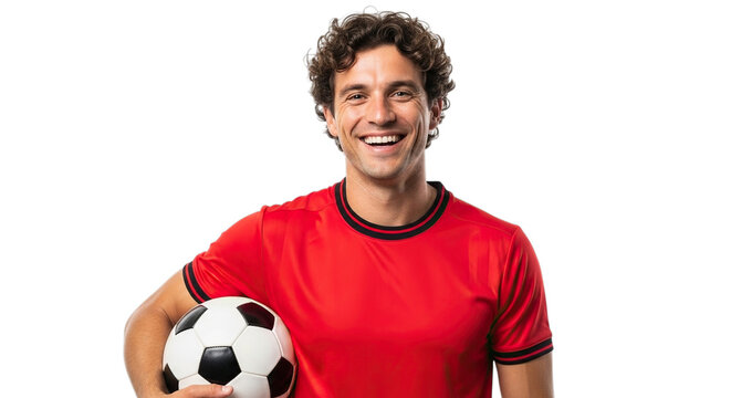 Smiling young man in red soccer jersey holding a classic black and white football isolated on transparent background