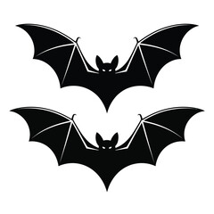 Fototapeta premium Two silhouetted bats with wings spread on a white background