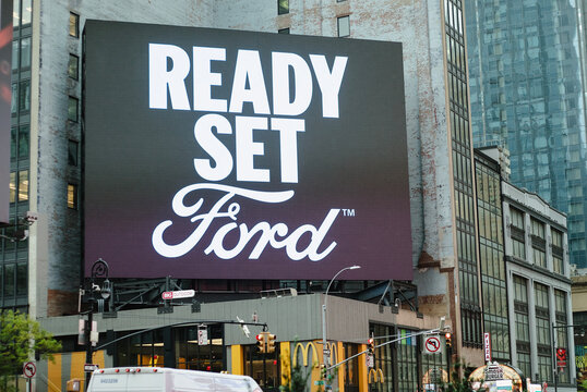 Cityscape with a large billboard reading  Ready Set Ford with city buildings and a McDonald's restaurant below in Times Square in New York City, New York, USA, November 4, 2025.