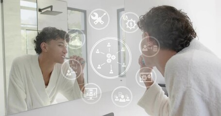 Man raising brush brushing teeth for oral health gear icons showing then fading on mirror smiling - Powered by Adobe