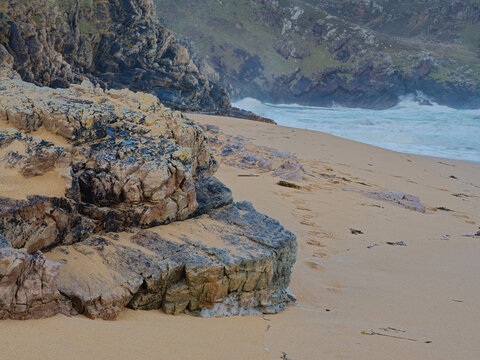 Rugged Rocky Murder Hole Beach in County Donegal Ireland With Sand Dunes and Crashing Waves