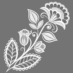 Intricate white floral design with detailed leaves and swirling stems on a solid grey background