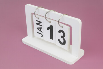 January, 13 on calendar on purple background.