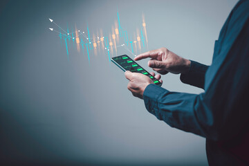 Mobile trading concept showing a person analyzing digital stock charts on a smartphone, highlighting modern finance, real-time investment decisions, and data-driven market strategies.