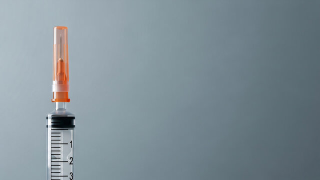 Closeup of a syringe with needle.