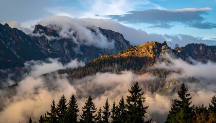 Ethereal fog covering distant mountain ridges at dawn