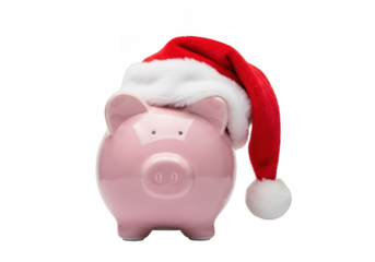 Pink piggy bank wearing a red santa hat, isolated on transparent background