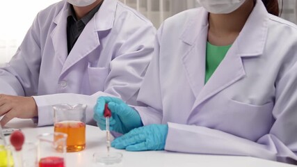 Laboratory healthcare researcher team with scientific expertise, lab equipment, and innovative medical biotechnology software in computer, research new medicines, develop cure. Slow motion. Rigid.