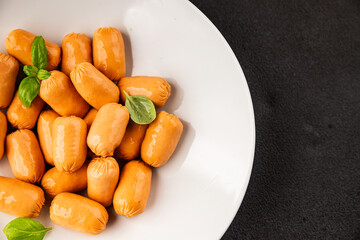 Sausage mini meat portion size fast food natural product tasty snack fresh delicious gourmet food background on table rustic top view copy space