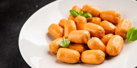 Sausage mini meat portion size fast food natural product tasty snack fresh delicious gourmet food background on table rustic top view copy space
