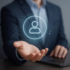 Businessman with glowing user icon and network elements in hand