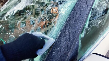 frost removal aids safe morning driving, cityscape reflection appears as frost melts from windshield, brisk winter morning prompts use of scraper to ensure road safety and visibility - Powered by Adobe