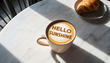 Coffee cup with Hello Sunshine latte art on a marble table
