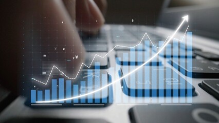 A close-up image captures a finger typing on a laptop keyboard, complemented by an overlay of financial charts and graphs showcasing market trends and data analysis. Copula