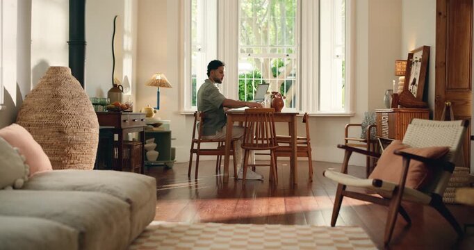 Creative, man and typing with laptop at house for research, proofreading and update draft. Male person, remote work and pc for article submission, manuscript document and agenda for story publication