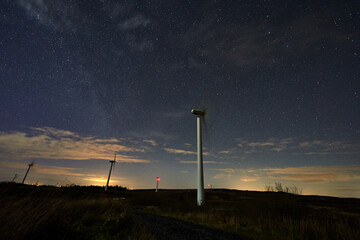 wind turbine at night.clean energy. wind turbine, eolic turbine, Power Plant, energy transmission, high voltage supply. scientific and technological advances.