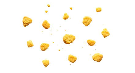 Scattered golden corn kernels on black background