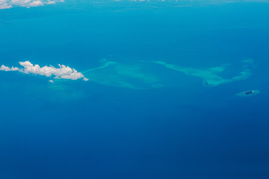 Aerial view of islands in the sea - Powered by Adobe