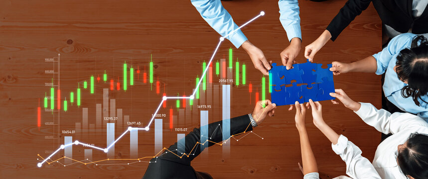 A dynamic team collaborates over a wooden table, solving puzzles while analyzing financial growth charts, showcasing unity in strategy and innovation for success. Scalp - Powered by Adobe