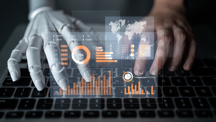 A captivating representation of the synergy between human and robot, showcasing advanced data visualization as both hands engage with a keyboard in a modern workspace. Scalp