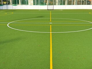 Basketball field with artificial green turf