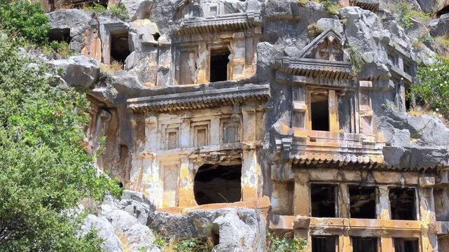 Rock-cut tombs of the ancient Lycian necropolis. Myra is an antique town in Lycia where the small town of Kale (Demre) Turkey. Close-up of rock cut tomb grave.