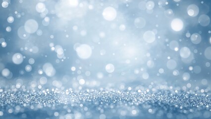 Fototapeta premium Shiny blue background with blurred glowing light circles and particles. Abstract festive or winter atmosphere. Bokeh effect.