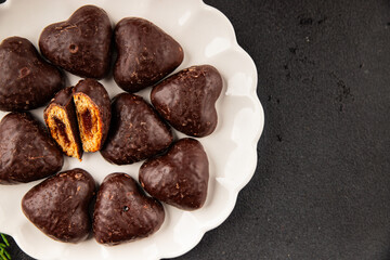 Gingerbread chocolate heart shaped honey cakes Christmas sweet dessert new year natural product tasty snack fresh delicious gourmet food background on the table rustic top view copy space