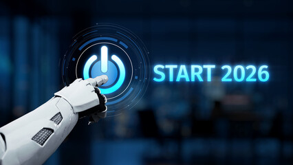 A robotic hand interacts with a glowing start button, symbolizing technological advancement and innovation poised to shape the future in 2026. Synapse