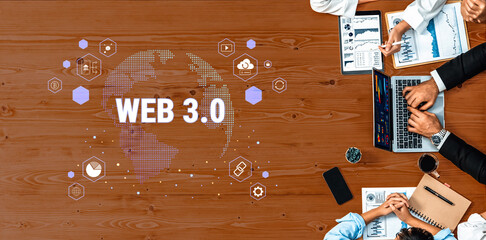 Business team collaborates on Web 3.0 project with modern devices, surrounded by charts and infographics, highlighting innovation in the office environment. Trope