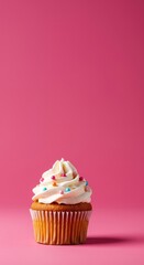 A vibrant pink background highlights a beautifully decorated cupcake, perfect for celebrations and sweet dessert themes ,icing ,vibrant ,whimsical
