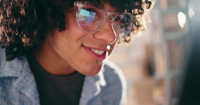 Man, laptop and happy at startup with logistics, review and glasses with notification for supply chain job. Person, computer and smile with inventory management, feedback and shipping at warehouse