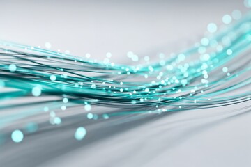 Close-up of glowing turquoise fiber optic cables symbolizing fast internet connection and digital data transfer.