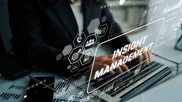 Professional Businesswoman Typing on Laptop with Digital Insight Management Overlay in Office Workspace. Asymptotic smart data analytic.