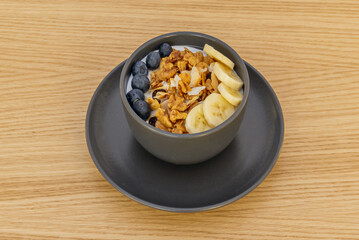 The promise of an energetic day begins with this hearty dish of puffed quinoa, berries, and a touch of hazelnut cream