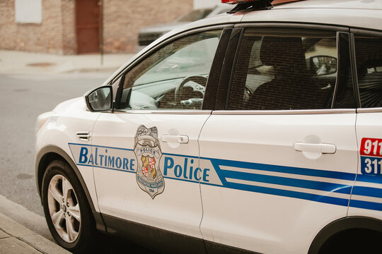 A Baltimore police car is parked in historic downtown Baltimore, Maryland, U.S. February 25, 2025