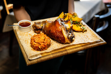 Traditional Bavarian Schweinshaxe served with Sides